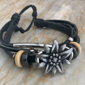 Black leather bracelet with beads and charms